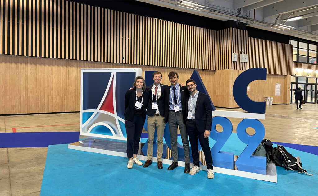 eSpace team in front of the IAC logo