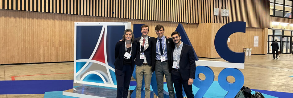 eSpace team in front of the IAC logo